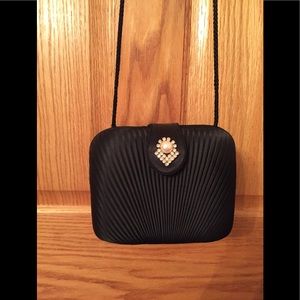 Structured fancy black evening bag with pearl